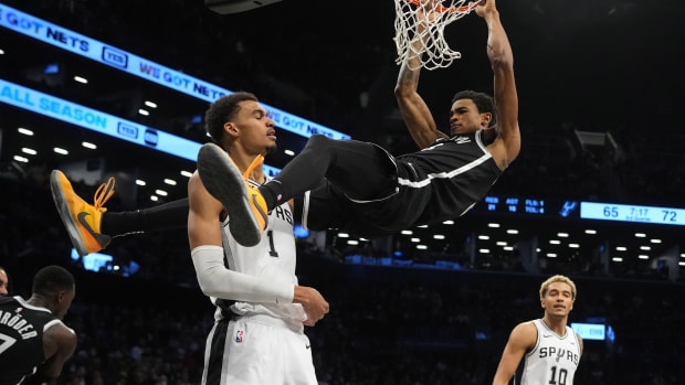 Brooklyn Nets center Nic Claxton (33) dunks the ball against San Antonio Spurs center Victor Wembanyama (1) 